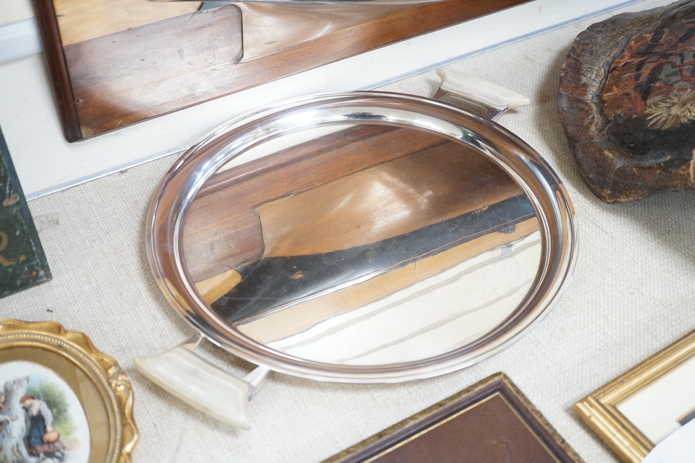 An Art Deco frameless mirror and an Art Deco plated tray, by Mappin & Webb.